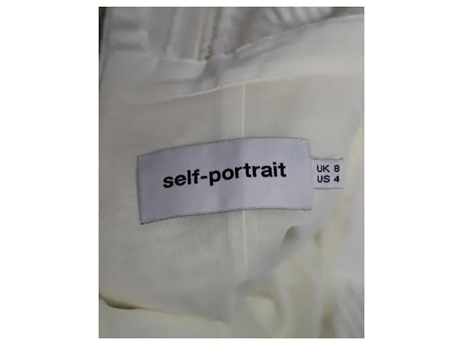 Self portrait Minivestido escalonado de encaje de guipur con lazo de autorretrato en poliéster blanco 